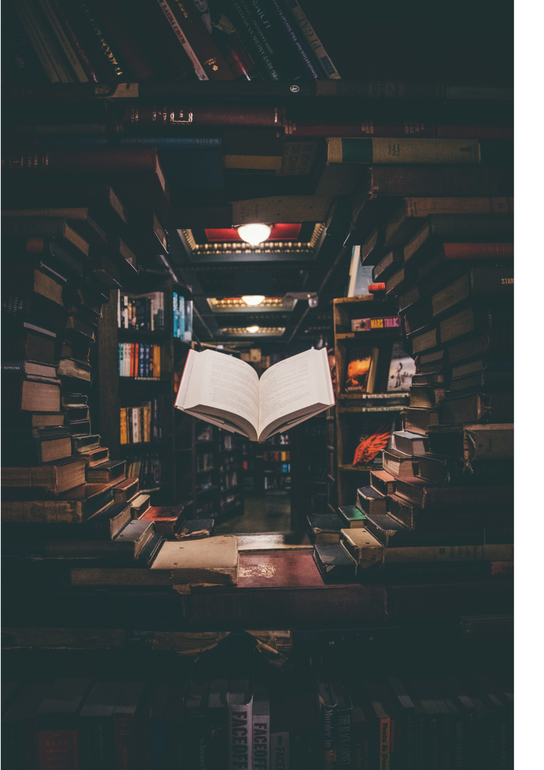 Book hovering in the middle of an open circle bookshelf