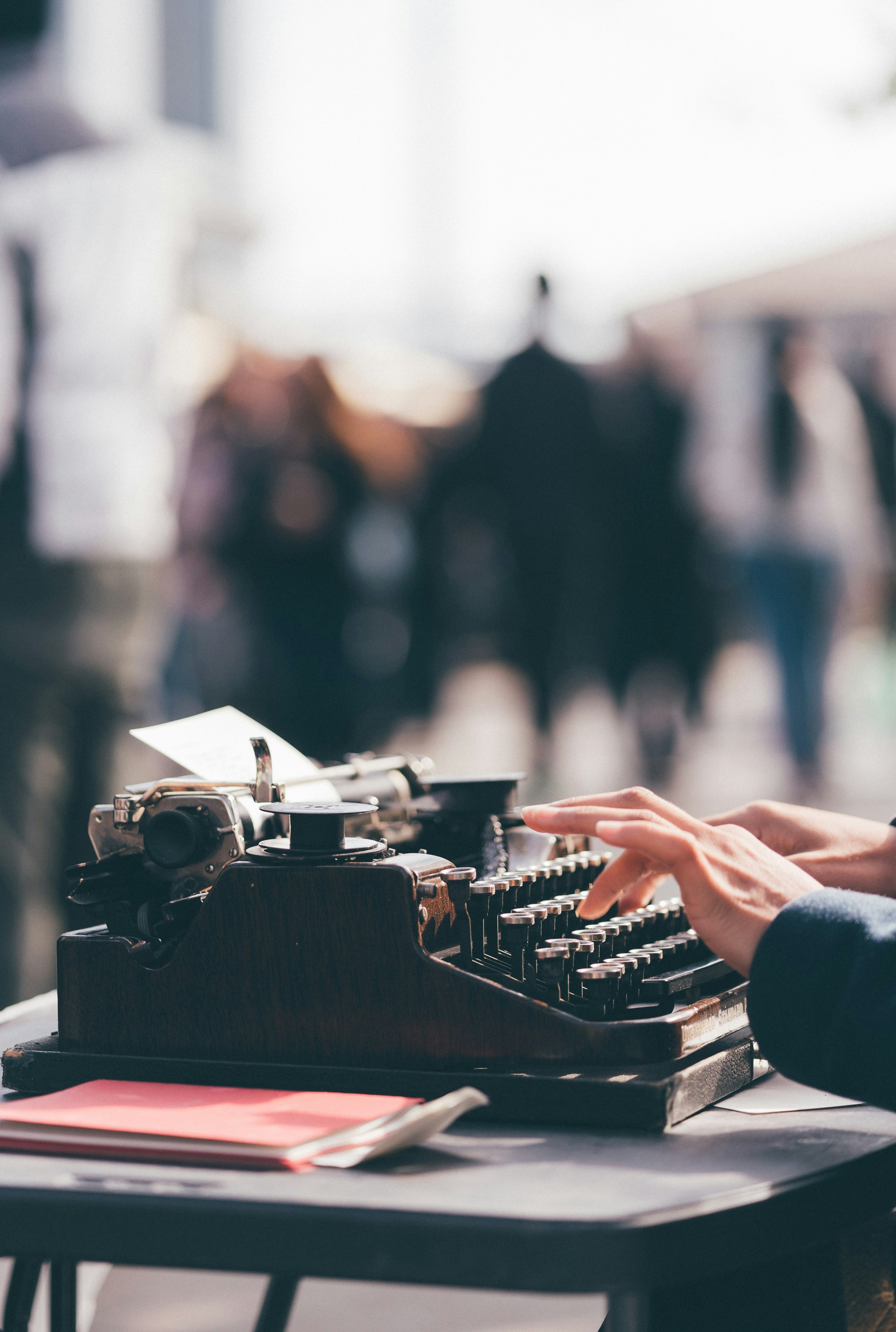 Person typing at a typewriter